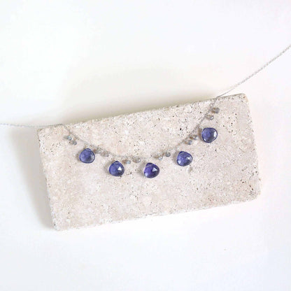 Tanzanite Quartz Silver Sparkler NecklaceA lovely string of sparkling gems.- Tanzanite Quartz &amp;amp; Labradorite gemstones- 16-18" long. Necklace has a 2" extender- Spring ring clasp- Rhodium plated .925 finNecklacesPARKEN JEWELRYVettedArcTanzanite Quartz Silver Sparkler Necklace