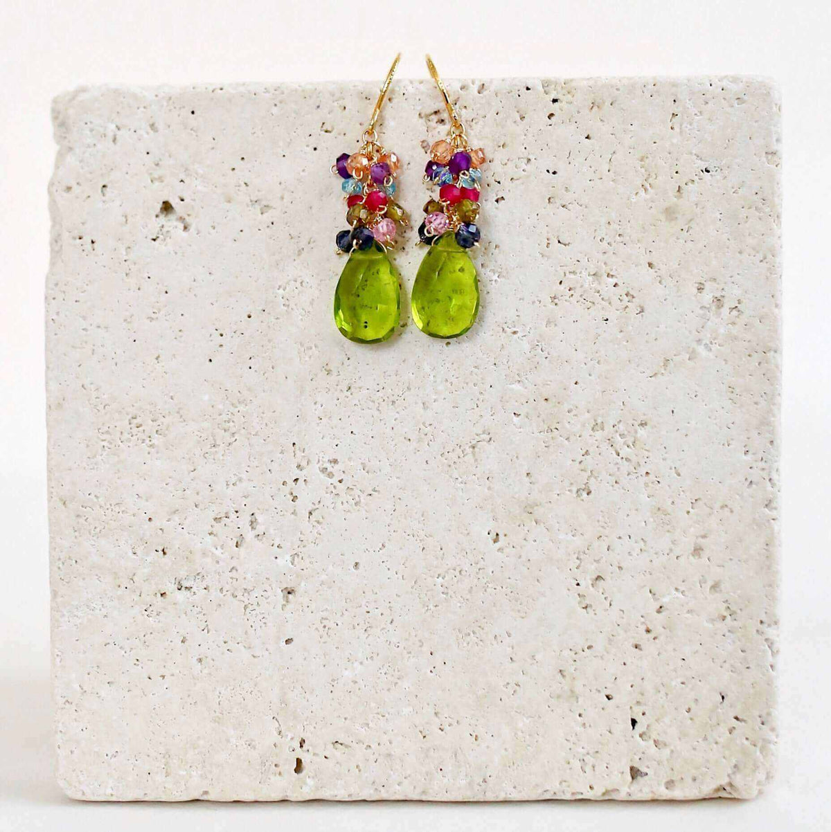 Peridot Quartz Bala EarringsStunning drops of color. Gold drop earrings made with peridot quartz topped with a rainbow cluster of gems.
- French hooks- 1.25" long- 14k gold plated .925 fine ItaEarringsPARKEN JEWELRYVettedArcPeridot Quartz