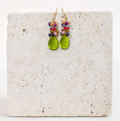 Peridot Quartz Bala EarringsStunning drops of color. Gold drop earrings made with peridot quartz topped with a rainbow cluster of gems.
- French hooks- 1.25" long- 14k gold plated .925 fine ItaEarringsPARKEN JEWELRYVettedArcPeridot Quartz