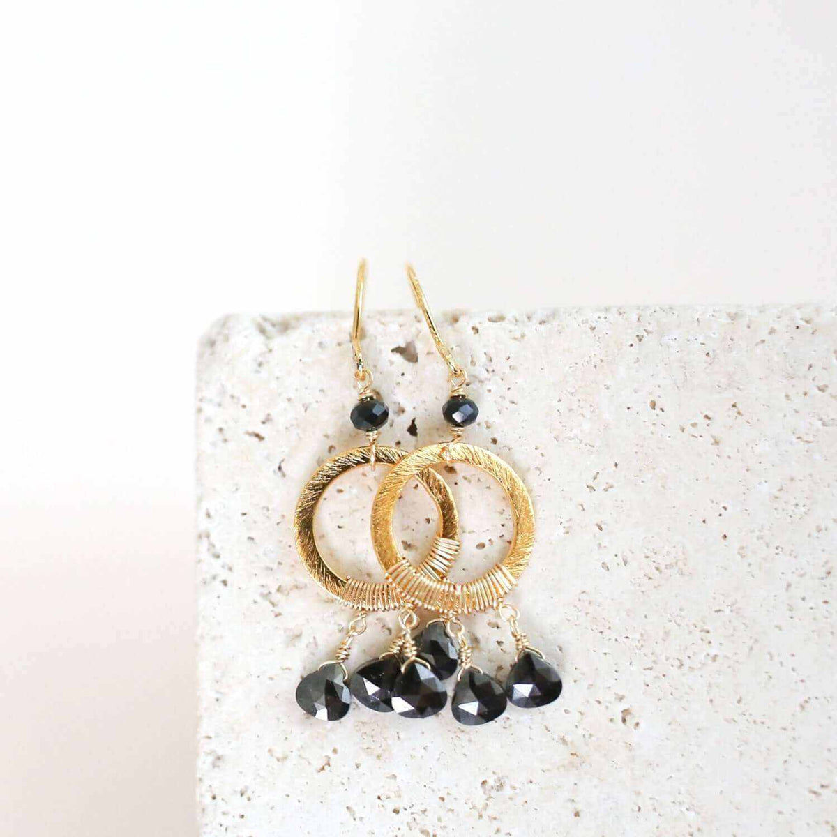 Black Spinel Mini Boho EarringsInspired by dream catchers, these boho minis are ready-to-wear with anything. 
- Black Spinel gemstones- 1.5" long- French Hooks- 14k gold plated over .925 Italian fEarringsPARKEN JEWELRYVettedArcBlack Spinel Mini Boho Earrings