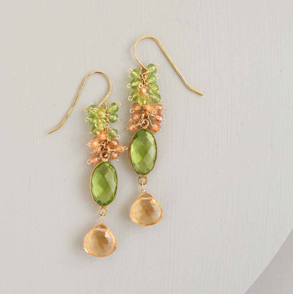 Citrine &amp; Peridot Bezel Cluster EarringsDripping in gems, these long drop earrings are made with a peridot quartz bezel paired with citrine and peridot gemstones.- 2.5" long- French hooks- 14k gold plated EarringsPARKEN JEWELRYVettedArcCitrine &amp; Peridot Bezel Cluster Earrings