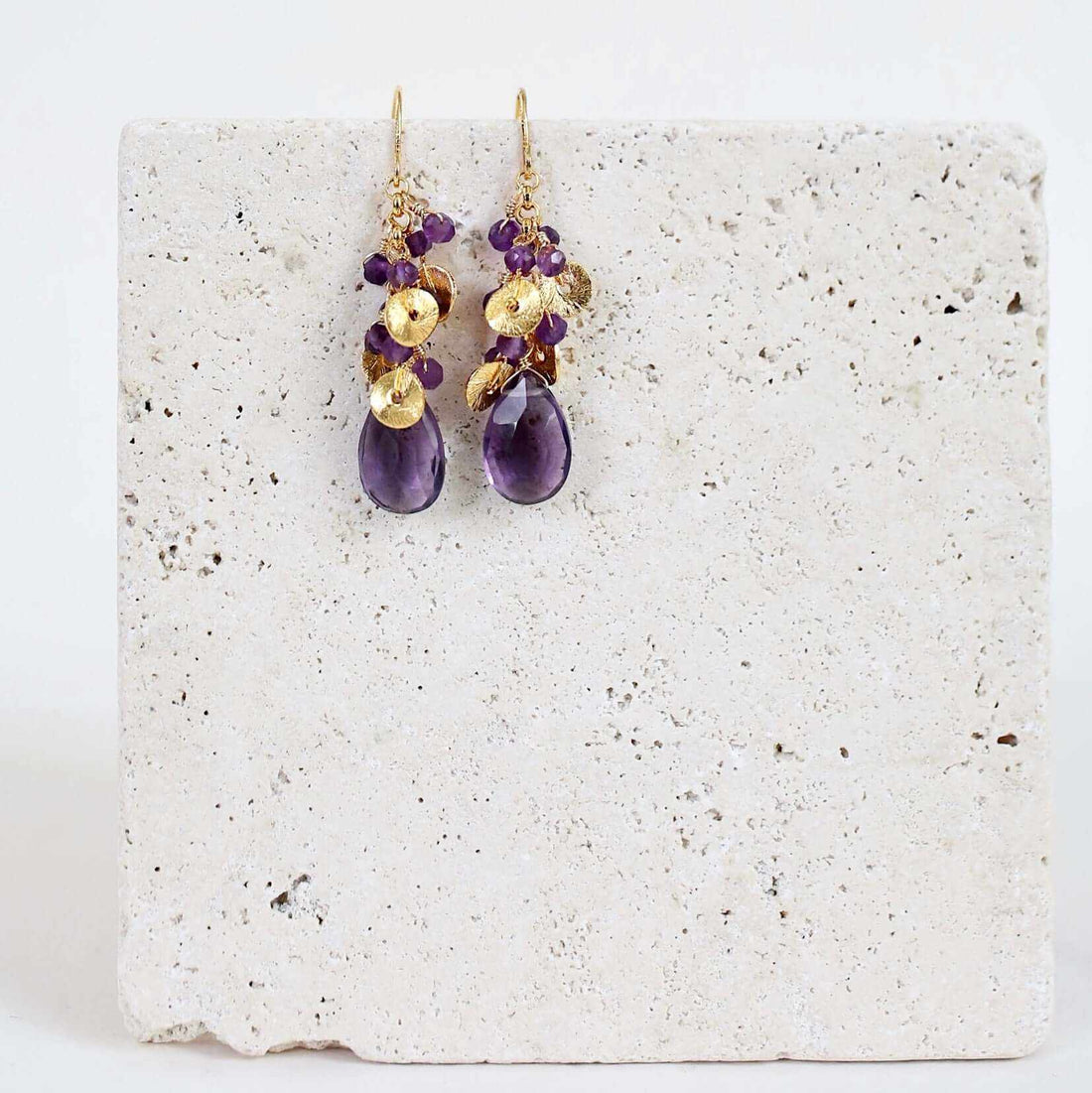 Amethyst Aurora EarringsBeautiful small gold earrings made with oval shaped amethyst gemstones and a cluster of gold and amethyst gemstone accents.
- 1.5" long- French hooks
- 14k gold platEarringsPARKEN JEWELRYVettedArcAmethyst Aurora Earrings