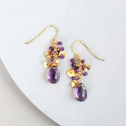 Amethyst Aurora EarringsBeautiful small gold earrings made with oval shaped amethyst gemstones and a cluster of gold and amethyst gemstone accents.
- 1.5" long- French hooks
- 14k gold platEarringsPARKEN JEWELRYVettedArcAmethyst Aurora Earrings