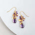 Amethyst Aurora EarringsBeautiful small gold earrings made with oval shaped amethyst gemstones and a cluster of gold and amethyst gemstone accents.
- 1.5" long- French hooks
- 14k gold platEarringsPARKEN JEWELRYVettedArcAmethyst Aurora Earrings