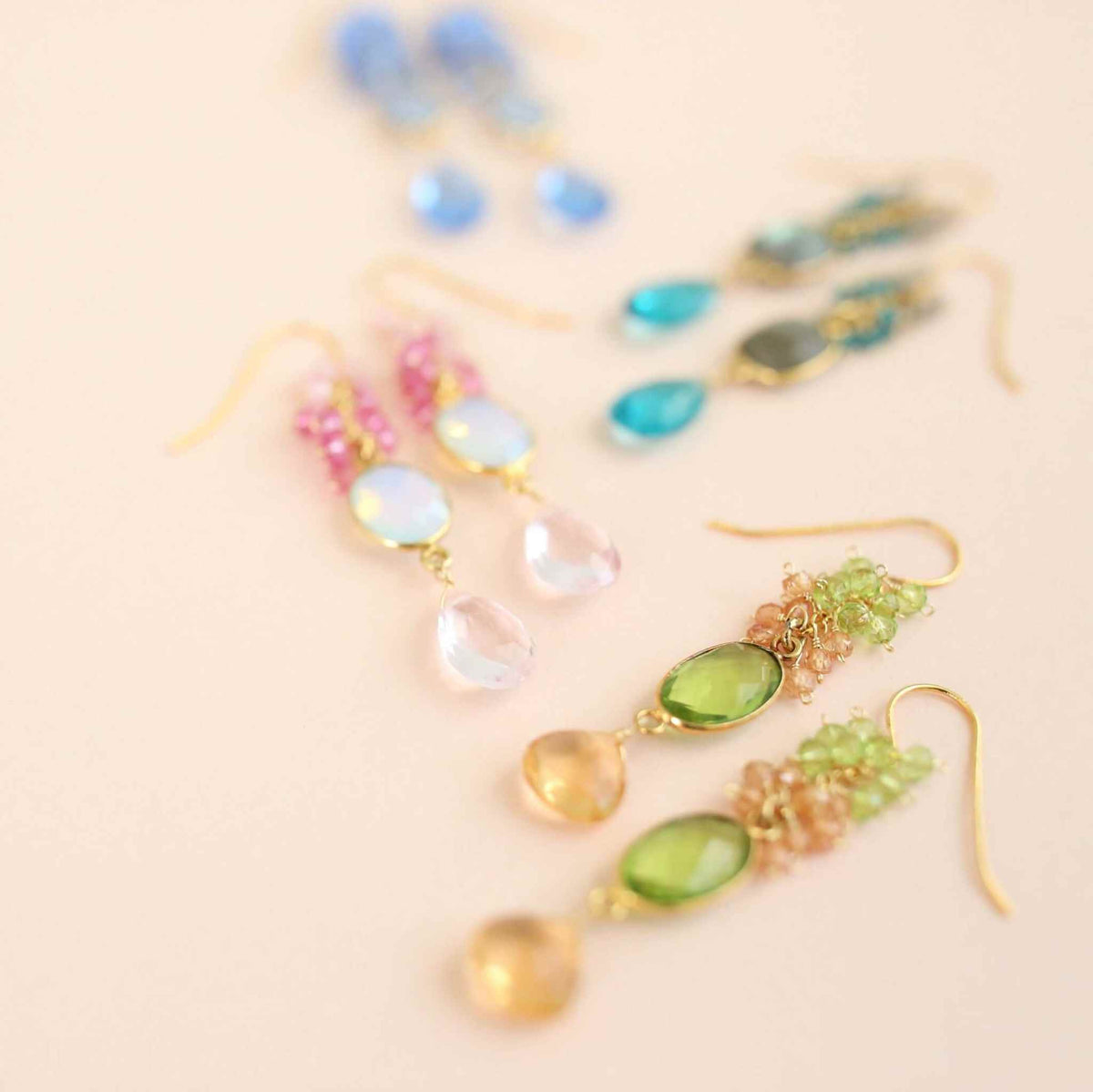 Citrine &amp; Peridot Bezel Cluster EarringsDripping in gems, these long drop earrings are made with a peridot quartz bezel paired with citrine and peridot gemstones.- 2.5" long- French hooks- 14k gold plated EarringsPARKEN JEWELRYVettedArcCitrine &amp; Peridot Bezel Cluster Earrings