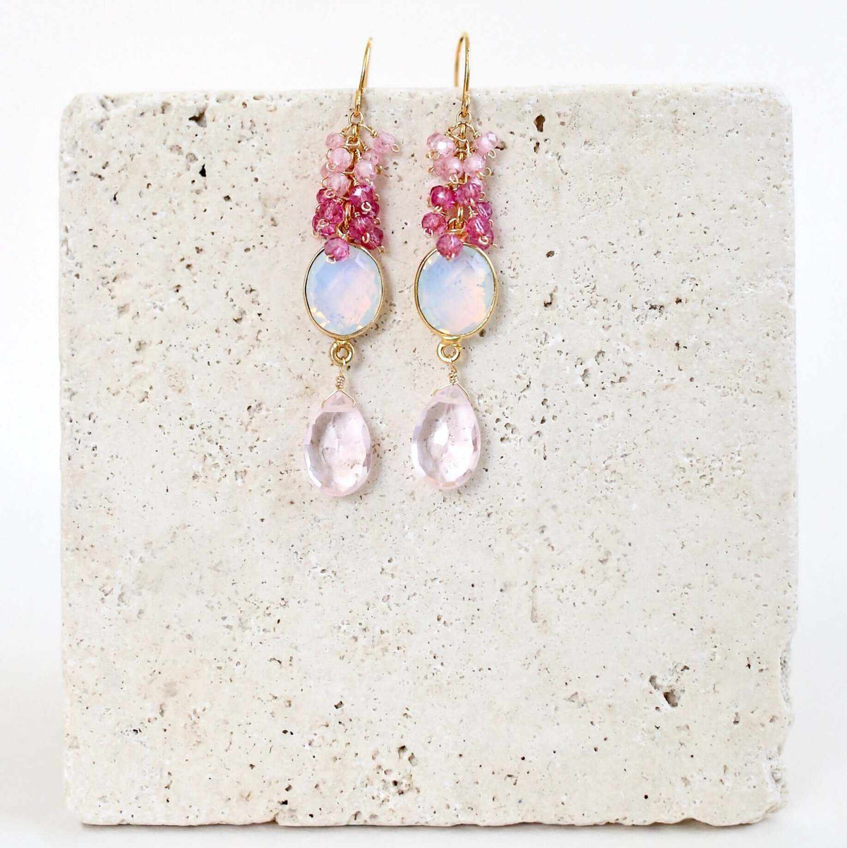 Bezel Cluster EarringsDripping in gems, these long gemstone drop earrings are a handmade combination of beautiful bezel set stones and clusters of gems.- 2.5" long- French hooks- 14k goldEarringsPARKEN JEWELRYVettedArcBezel Cluster Earrings