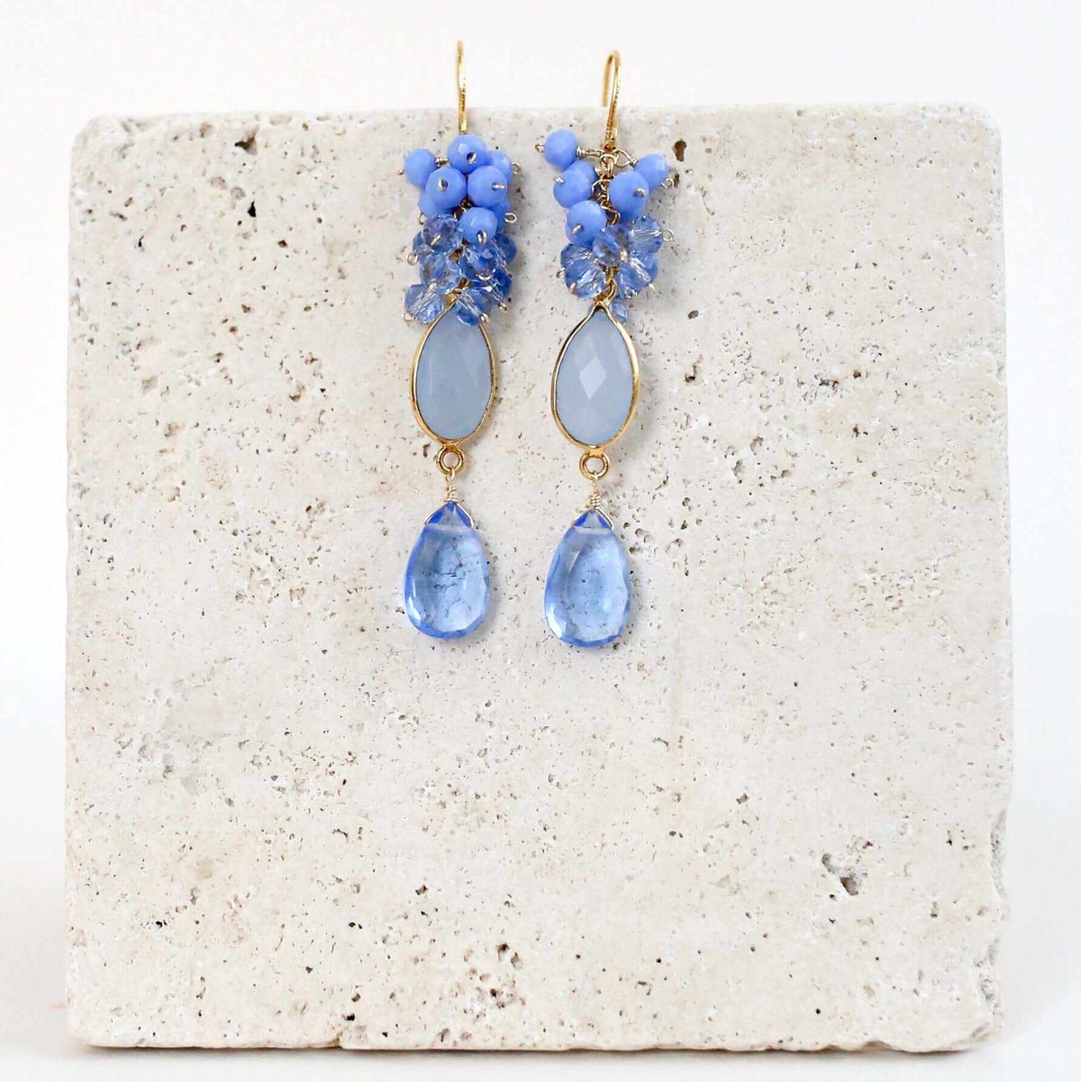 Bezel Cluster EarringsDripping in gems, these long gemstone drop earrings are a handmade combination of beautiful bezel set stones and clusters of gems.- 2.5" long- French hooks- 14k goldEarringsPARKEN JEWELRYVettedArcBezel Cluster Earrings