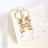 Citrine & Smoky Quartz Ammil EarringsMultiple strands of lush gems sparkle on a 1" hoop.
- Citrine and Smoky Quartz gemstones- 3.5" long- French hooks- 14k gold plated .925 fine Italian sterling silver-EarringsPARKEN JEWELRYVettedArcCitrine & Smoky Quartz Ammil Earrings