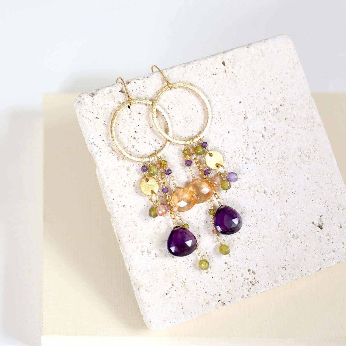 Iolite &amp; Aquamarine Ammil EarringsMultiple strands of lush gems sparkle on a 1" hoop.
- Aquamarine Quartz and Iolite gemstones- 3.5" long- French hooks- 14k gold plated .925 fine Italian sterling silEarringsPARKEN JEWELRYVettedArcIolite &amp; Aquamarine Ammil Earrings