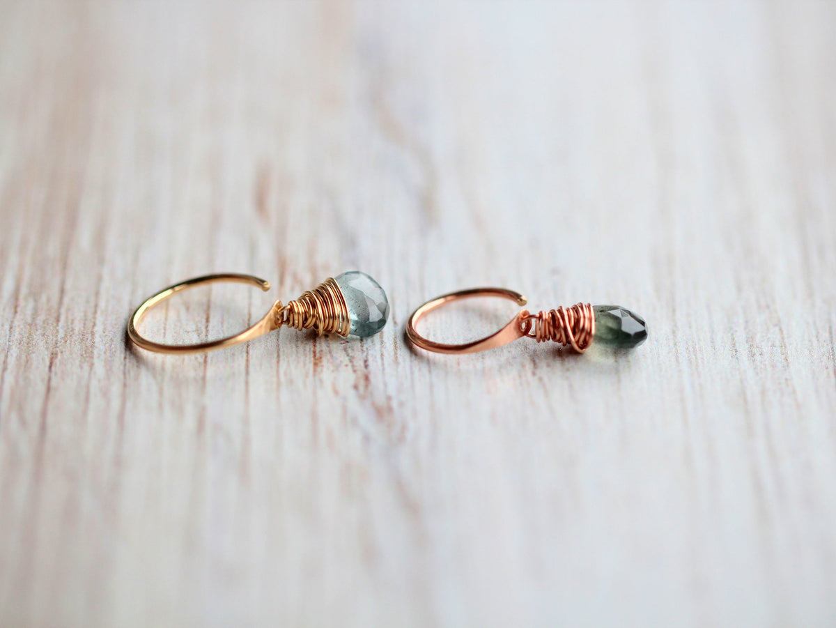 Moss aquamarine dangle hug earrings worn on ear, green gemstone drop detail