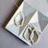 Labradorite Freestyle Jewelry SetCompletely one-of-a-kind, Labradorite gold pendant and earrings set. Each one is a unique, amorphous shape.
Floating pendant is strung on a very delicate chain that Necklace/Earring KitPARKEN JEWELRYVettedArcLabradorite Freestyle Jewelry Set