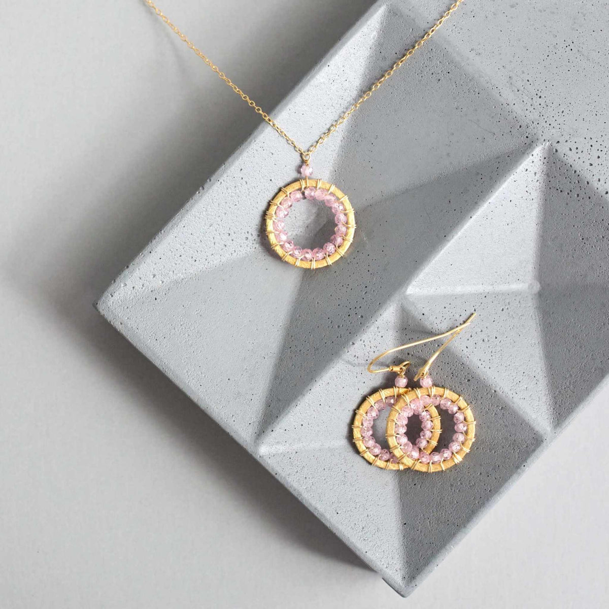 Rose Quartz Halo Jewelry SetThe mini version of our exclusive Mason Circle Collection. Our pretty mini circle eternity necklace+ mini hoops all featuring shimmering pink rose quartz gemstones.
Necklace/Earring SetPARKEN JEWELRYVettedArcRose Quartz Halo Jewelry Set