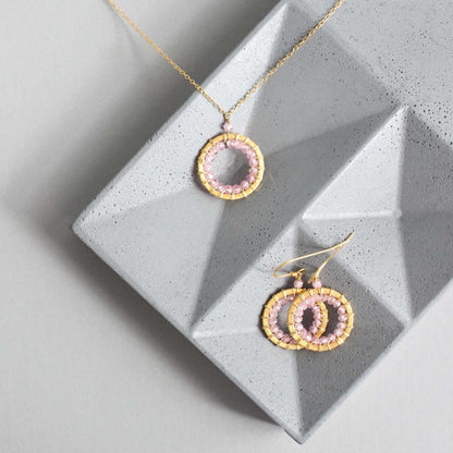 Rose Quartz Halo Jewelry SetThe mini version of our exclusive Mason Circle Collection. Our pretty mini circle eternity necklace+ mini hoops all featuring shimmering pink rose quartz gemstones.
Necklace/Earring SetPARKEN JEWELRYVettedArcRose Quartz Halo Jewelry Set