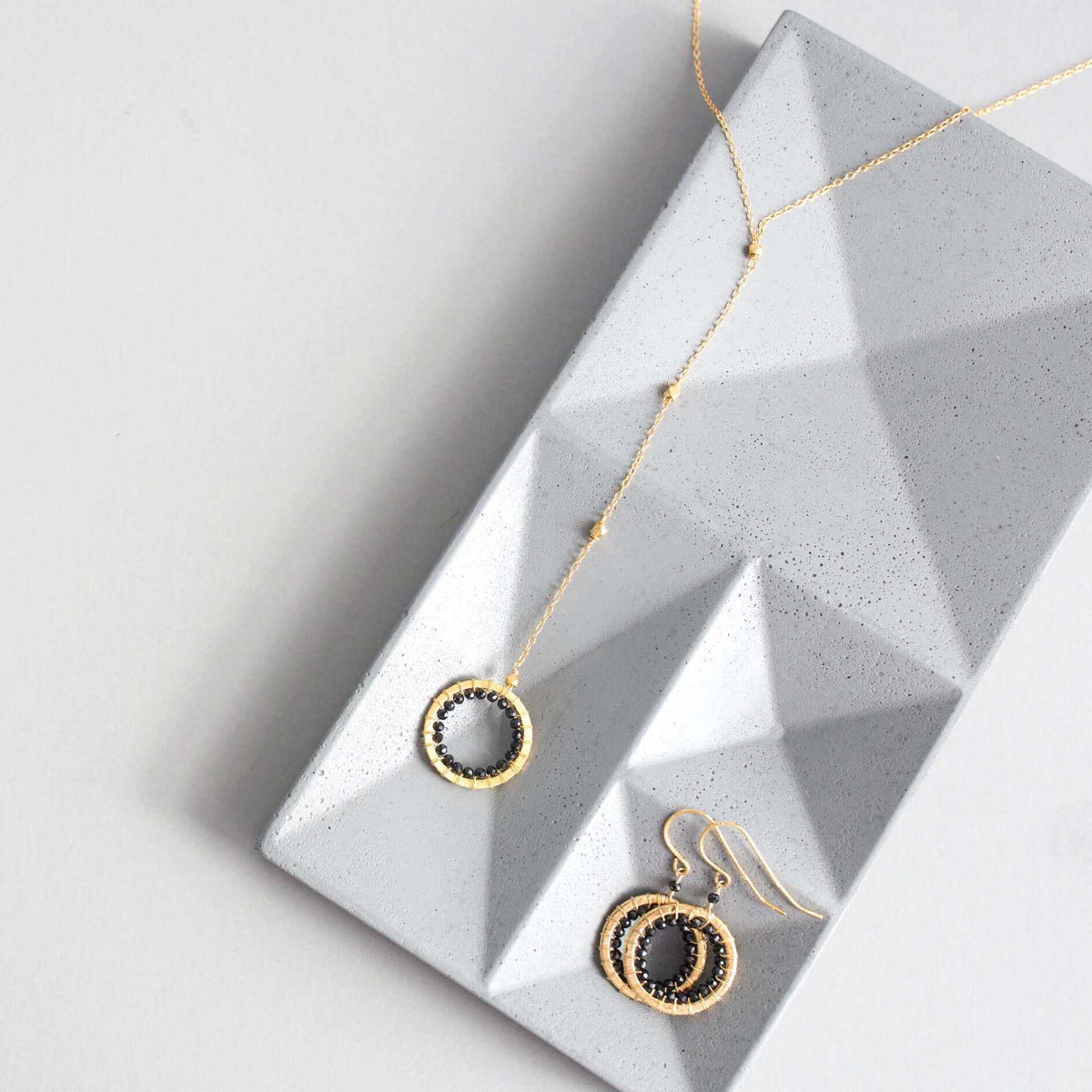 Black Spinel Mini Halo EarringsThe Halo collection was our very first one. Intended to symbolize the intricate, universal energy woven within us all. These small, sparkling Black Spinel earrings aEarringsPARKEN JEWELRYVettedArcBlack Spinel