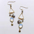 Opalite Chandie EarringsOur "chandies" are a modern take on classic chandelier earrings, using gemstone color combos and varying stone shapes and sizes. This pair features bezel set opal quEarringsPARKEN JEWELRYVettedArcOpalite Chandie Earrings