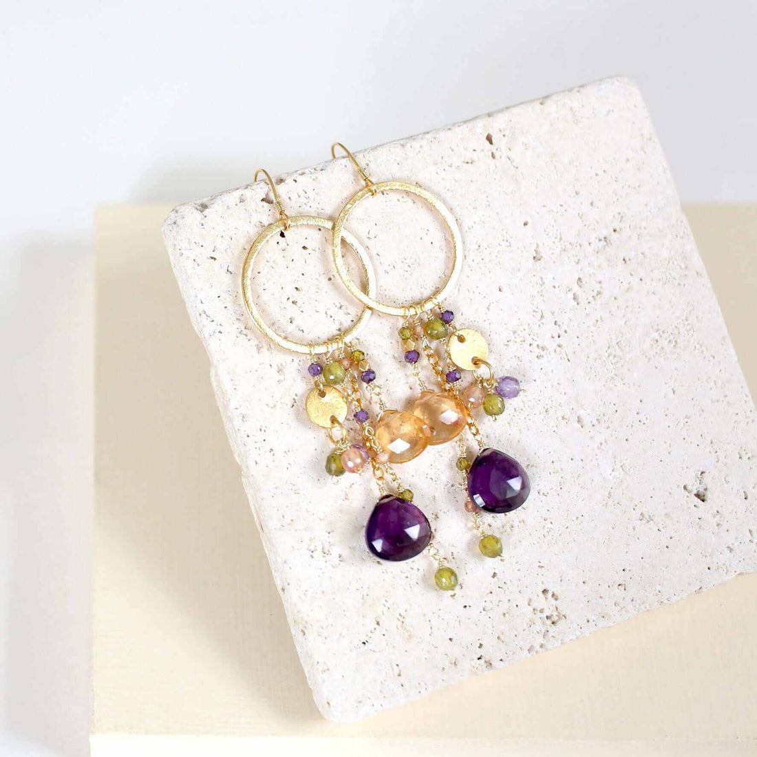 Amethyst &amp; Citrine Ammil EarringsMultiple strands of lush gems sparkle on a 1" hoop.
- Amethyst and Citrine gemstones- 3.5" long- French hooks- 14k gold plated .925 fine Italian sterling silver- MadEarringsPARKEN JEWELRYVettedArcAmethyst &amp; Citrine Ammil Earrings