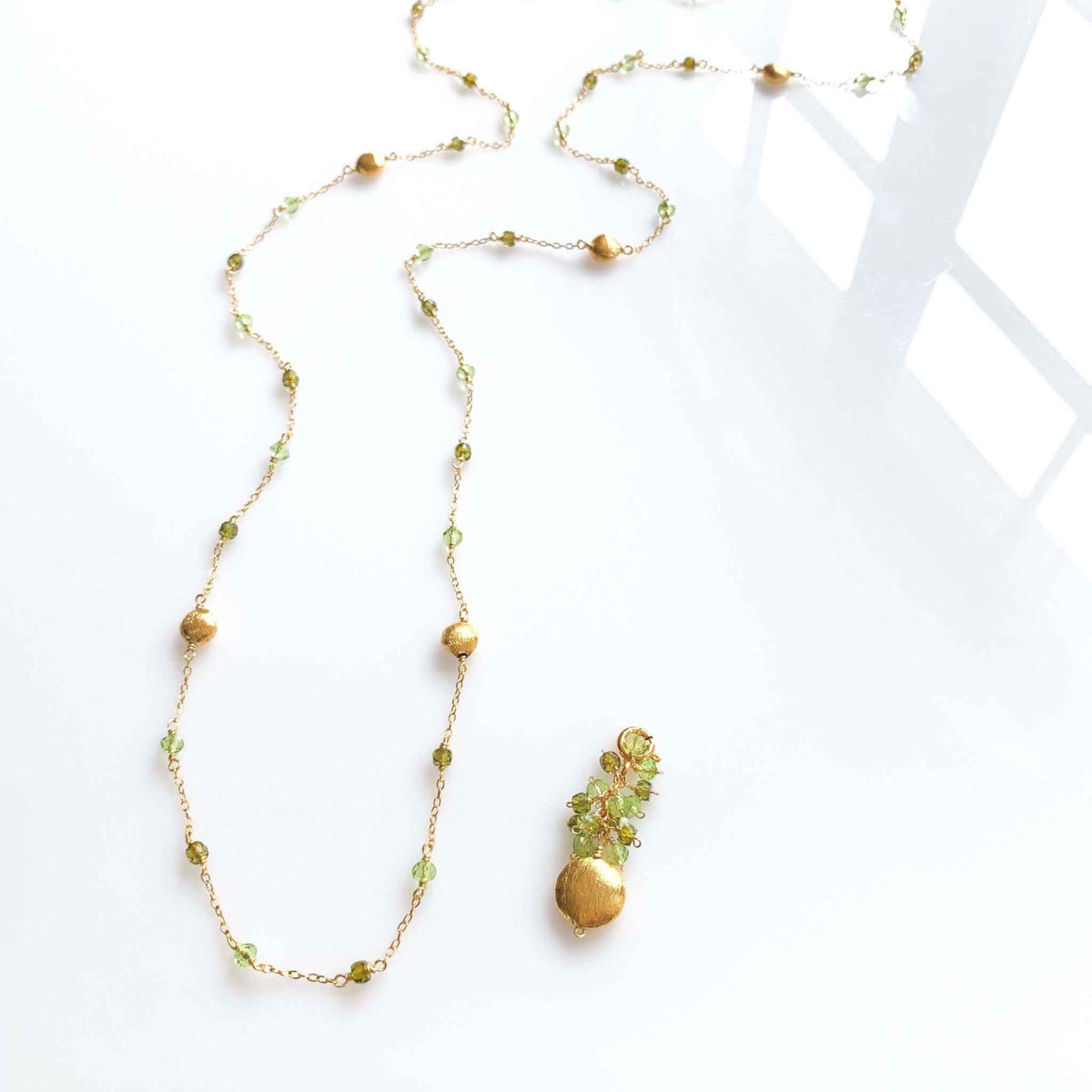 Long Peridot &amp; Green Amethyst Beaded ChainGet gorgeous sparkle from this long convertible gemstone necklace. Made with Peridot and Green Amethyst Gemstones. Necklace can be worn multiple ways. Detach the gemNecklacesPARKEN JEWELRYVettedArcLong Peridot &amp; Green Amethyst Beaded Chain