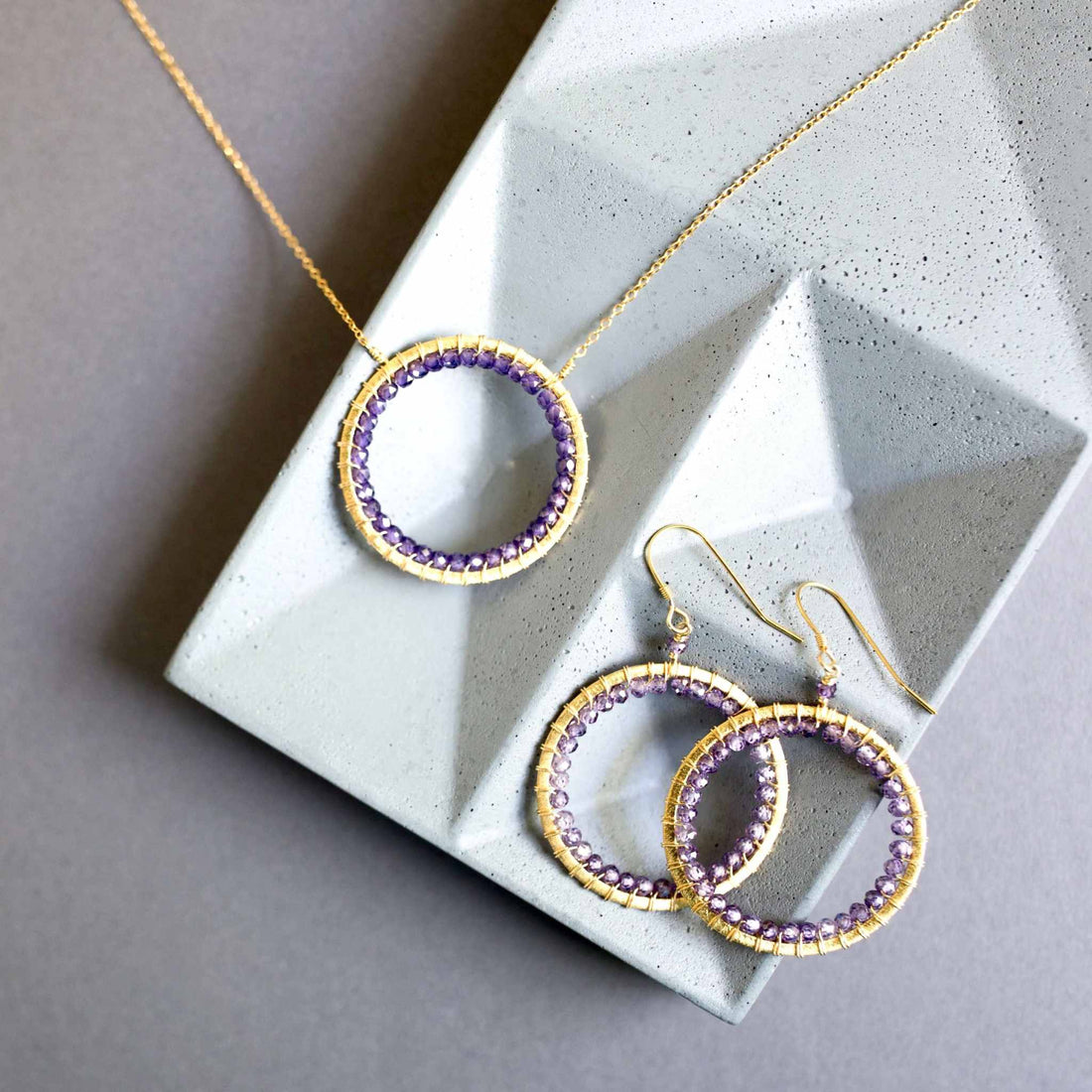 Amethyst Halo Jewelry SetThe Halo collection was our very first one. Intended to symbolize the intricate, universal energy woven within us all. This beautiful set is ultra lightweight and peNecklace/Earring SetPARKEN JEWELRYVettedArcAmethyst Halo Jewelry Set