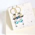 Iolite & Aquamarine Ammil EarringsMultiple strands of lush gems sparkle on a 1" hoop.
- Aquamarine Quartz and Iolite gemstones- 3.5" long- French hooks- 14k gold plated .925 fine Italian sterling silEarringsPARKEN JEWELRYVettedArcIolite & Aquamarine Ammil Earrings