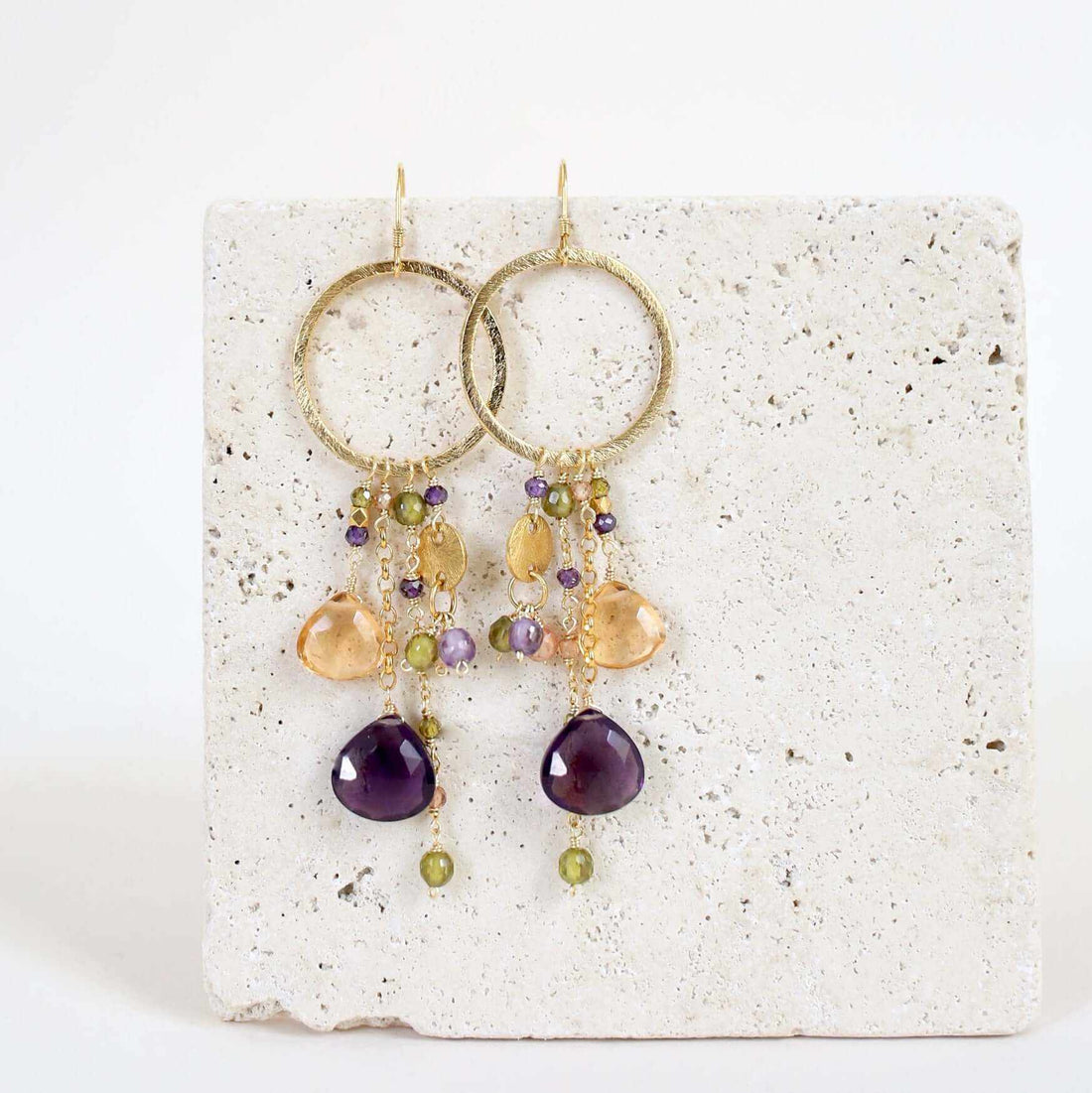 Amethyst &amp; Citrine Ammil EarringsMultiple strands of lush gems sparkle on a 1" hoop.
- Amethyst and Citrine gemstones- 3.5" long- French hooks- 14k gold plated .925 fine Italian sterling silver- MadEarringsPARKEN JEWELRYVettedArcAmethyst &amp; Citrine Ammil Earrings