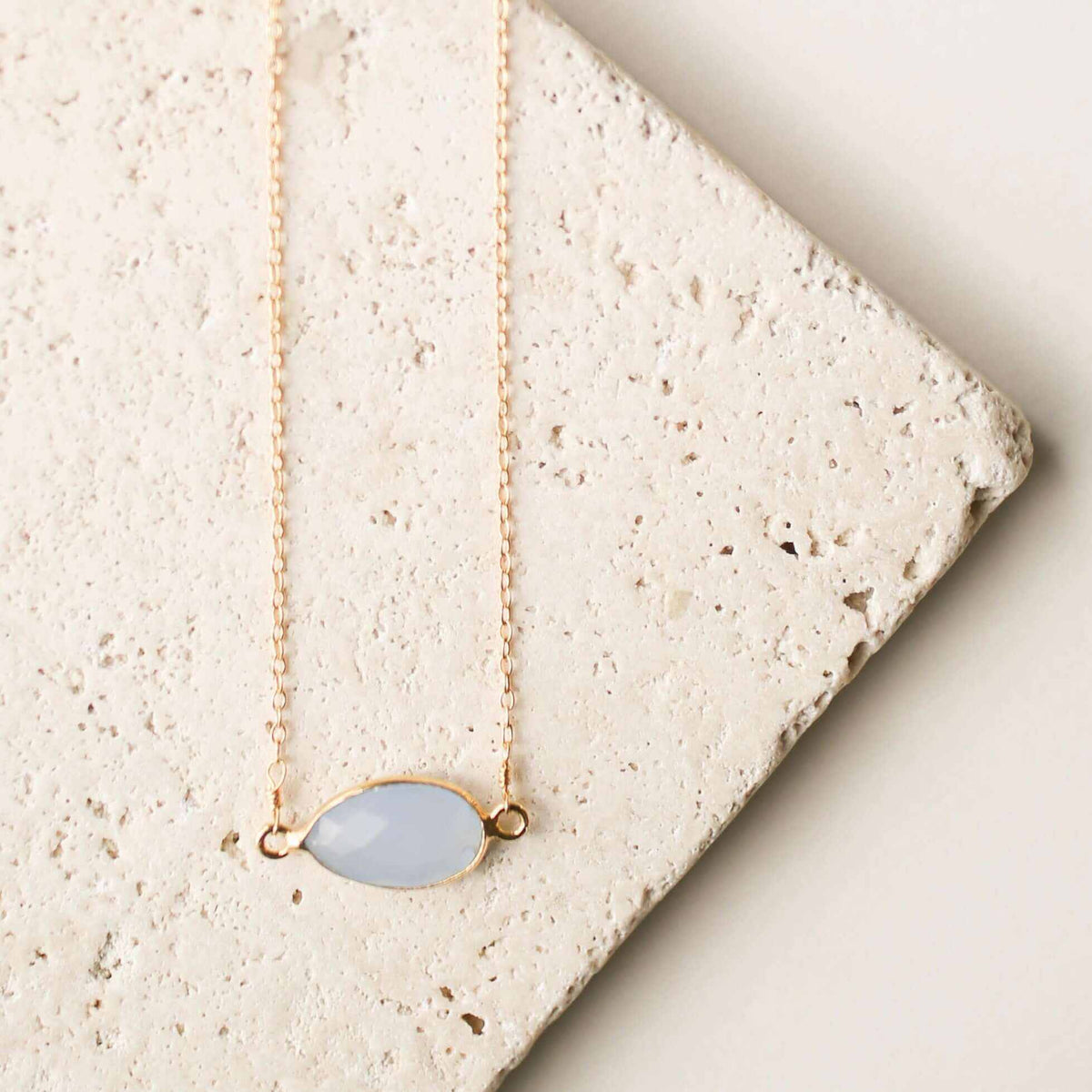 Gold minimalist necklace with blue chalcedony stone and spring ring clasp
