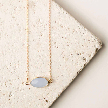 Gold minimalist necklace with blue chalcedony stone and spring ring clasp