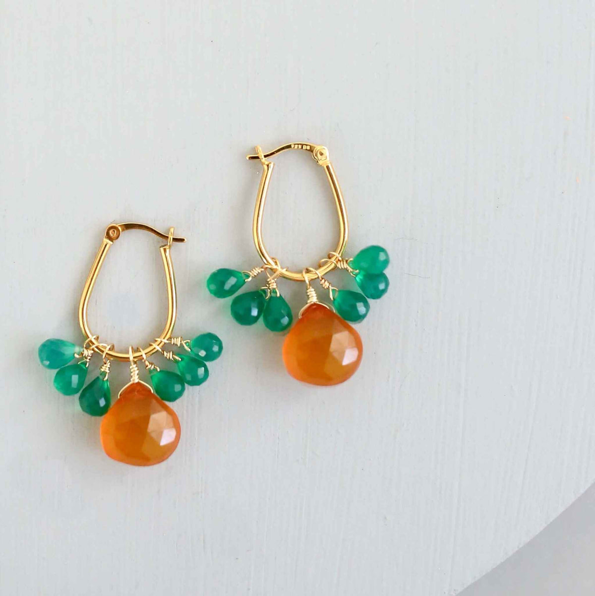 Dark Orange Chalcedony &amp; Green Onyx Gold EarringsSmall but mighty rich color. Beautiful dark orange chalcedony paired with green onyx briolettes.
- 1.5 inches long- Latch backs- 14k gold plated .925 fine Italian stEarringsPARKEN JEWELRYVettedArcDark Orange Chalcedony