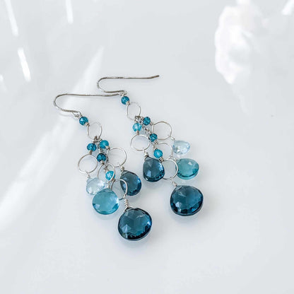 Iolite &amp; Aquamarine Gold Waterfall EarringsElegant Iolite &amp;amp; Aquamarine Gold Waterfall Earrings feature a unique tiered chandelier earring design, set in 14k gold plated over fine .925 Italian sterling silEarringsPARKEN JEWELRYVettedArcIolite &amp; Aquamarine