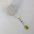 Peridot green quartz yoga pendant necklace in gold with multicolor accent stones