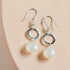 The Airie Earring featuring white chalcedony and rhodium plated sterling silver with French hooks